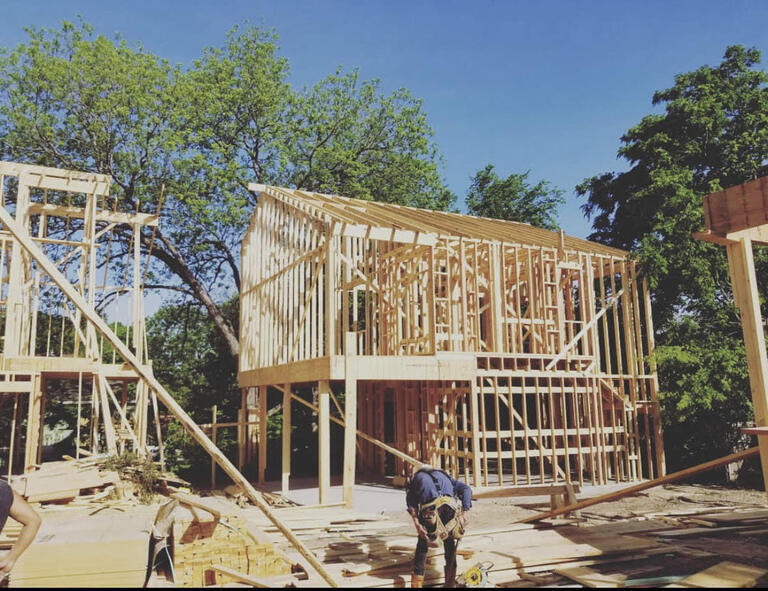 Open wood framing for a stand-alone two story ADU.